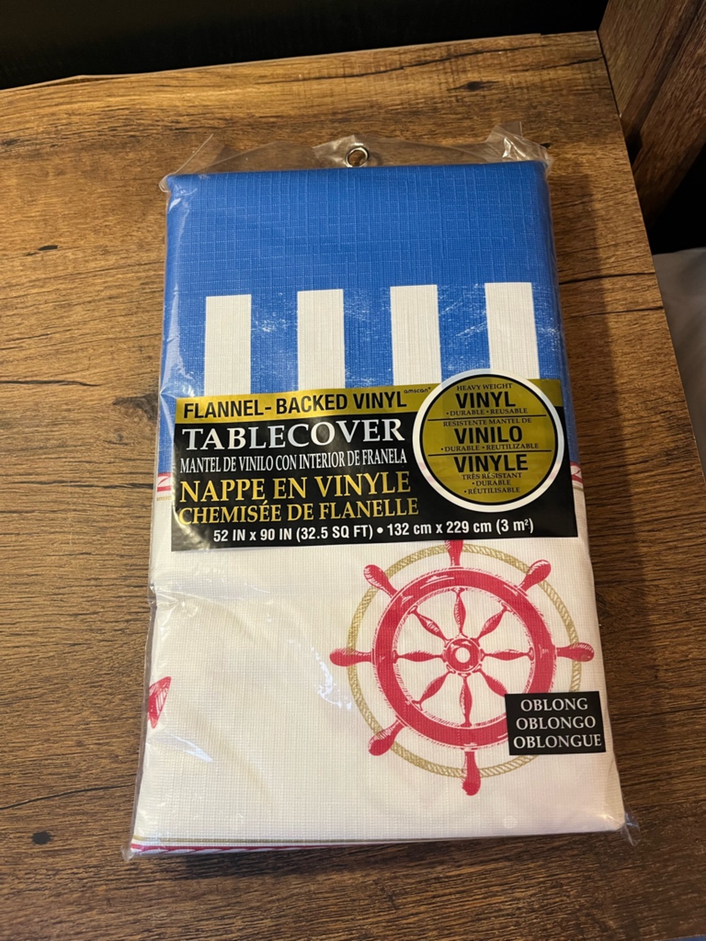 Vinyl Tablecover with Blue Stripes & Red Nautical Wheel Theme from Party City